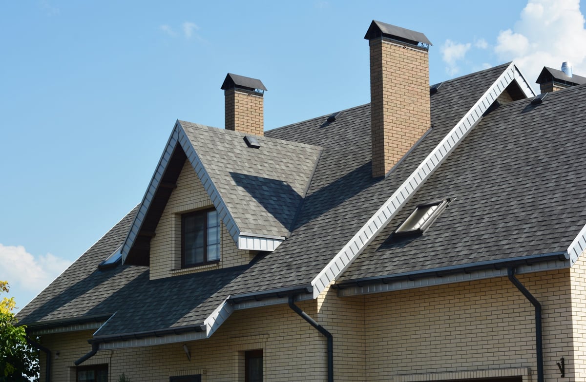 Rooftop with dormer window and new shingles